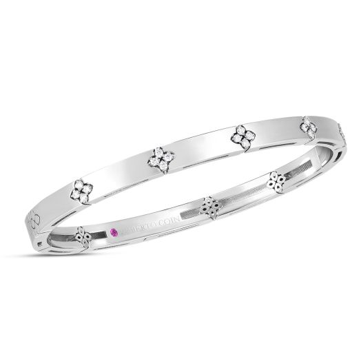 white gold bangle bracelet with diamond accented floral motifs