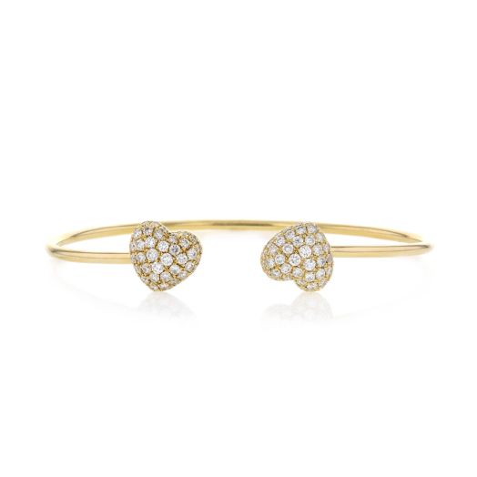 Gold open cuff style bracelet with two diamond hearts