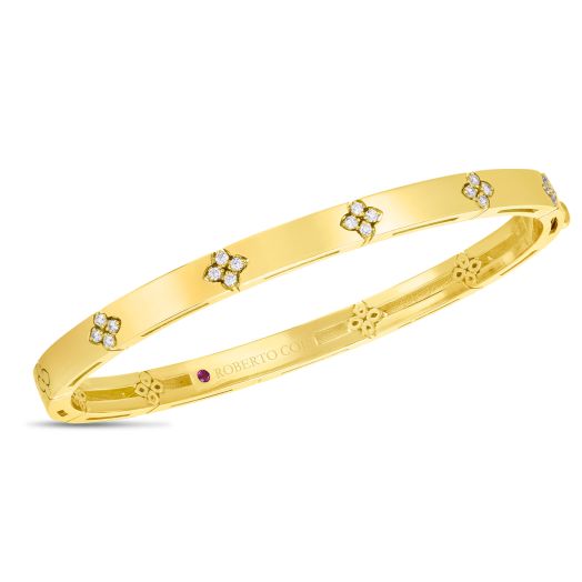 Yellow gold bangle with diamond accents