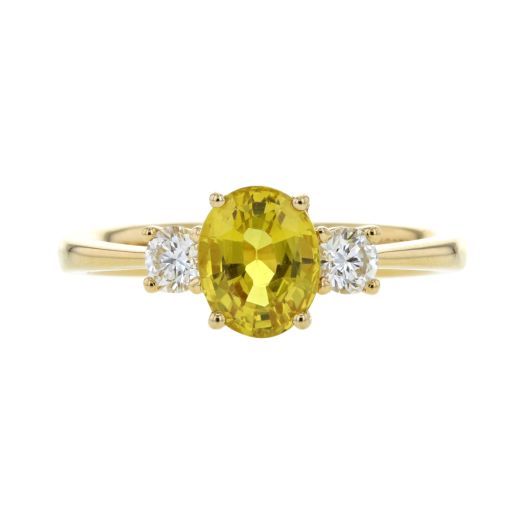 Yellow oval sapphire ring with diamond accents