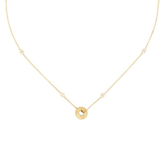 yellow gold necklace with interlocking G accents and round pendant with star cut out
