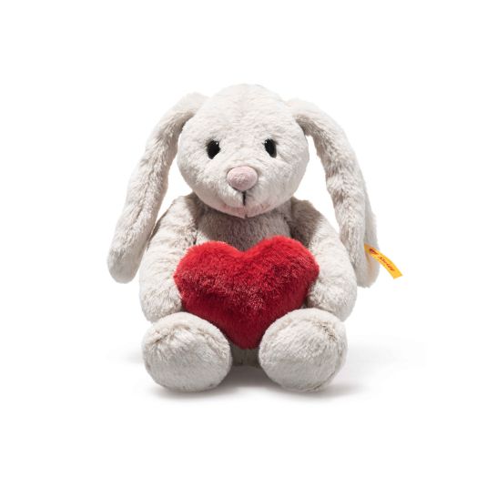 light grey rabbit stuffed animal holding red heart