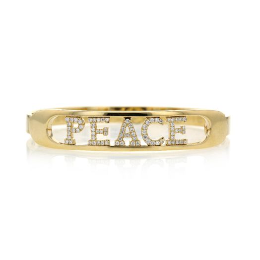 Gold "PEACE" bangle written in diamonds