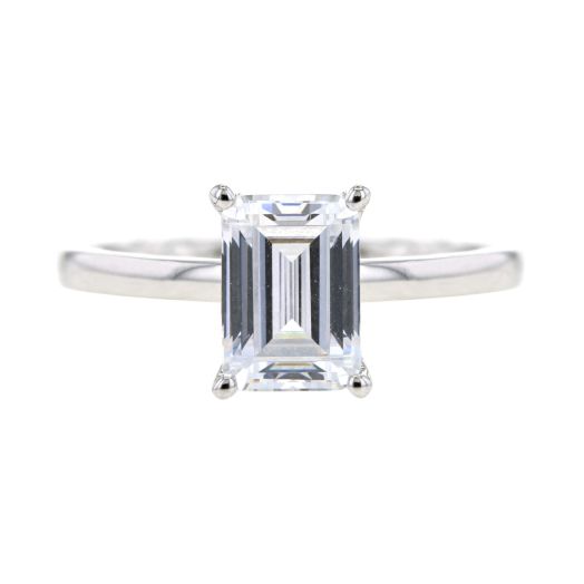 smoothed band ring with emerald-cut stone