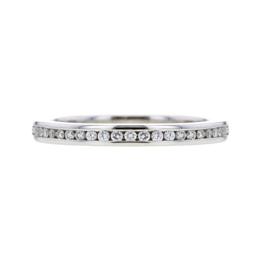 White gold diamond band crafted in a channel setting