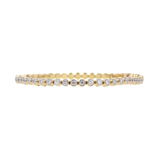 yellow gold stretch bracelet lined with round bezel set diamonds