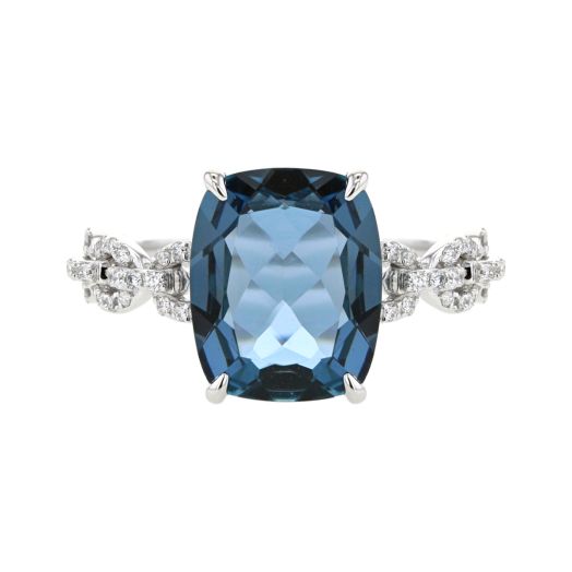 white gold ring with link design band accented with pave diamonds with a large blue topaz center stone
