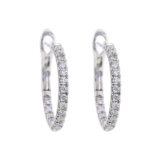 white gold hoop earrings lined with diamonds on the exterior and interior of the hoop