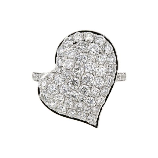 white gold ring lined with diamond rounds on the band, at the center of the ring is a whimsical off center diamond accented large heart