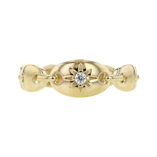 yellow gold large link ring with a celestial sunburst accented center with diamond round in center