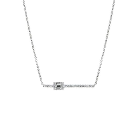 white gold necklace with bar lined with mini diamond rounds, large baguette diamond accent sits on one side of the  bar