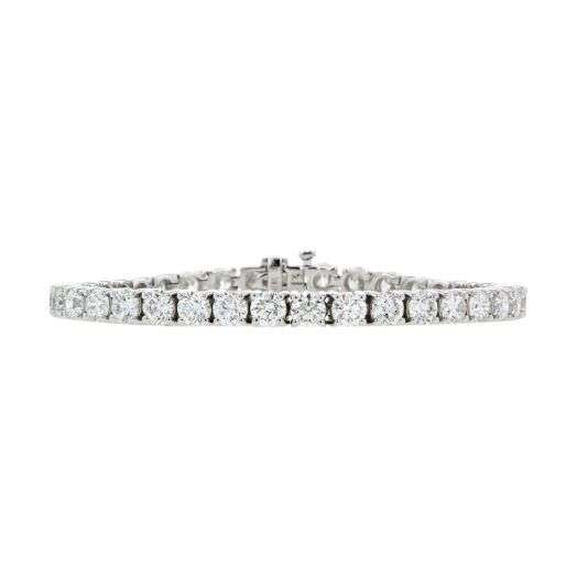 a classic diamond tennis bracelet in white gold featuring diamond rounds all the way around