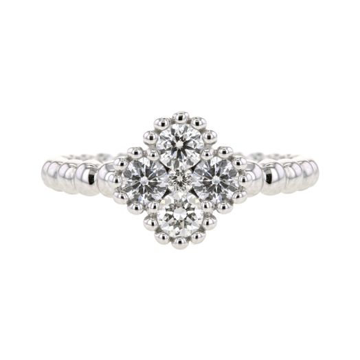 white gold beaded band with four diamonds set in a clover shape, accented with beaded halo