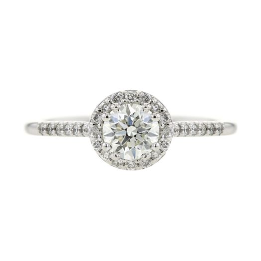 round-cut diamond center stone set in halo of white diamond rounds that extend onto white gold band