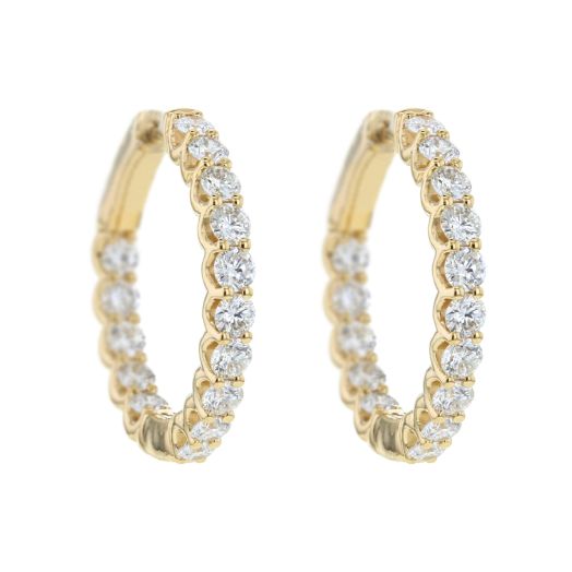 yellow gold hoop earrings lined with white diamond rounds in the interior and exterior of each hoop
