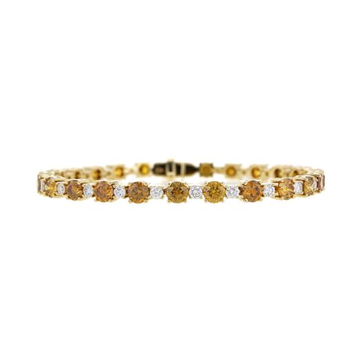 Yellow gold tennis bracelet that alternates between white and orange diamonds
