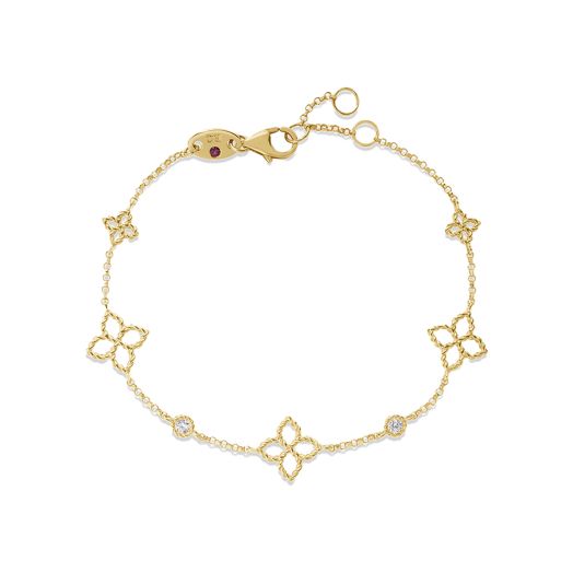 yellow gold bracelet with stationed diamond rounds and flower details