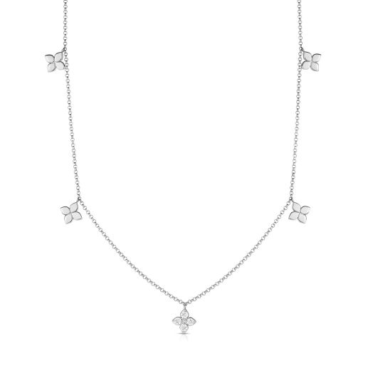 white gold necklace with petite flower stations, one accented with diamonds