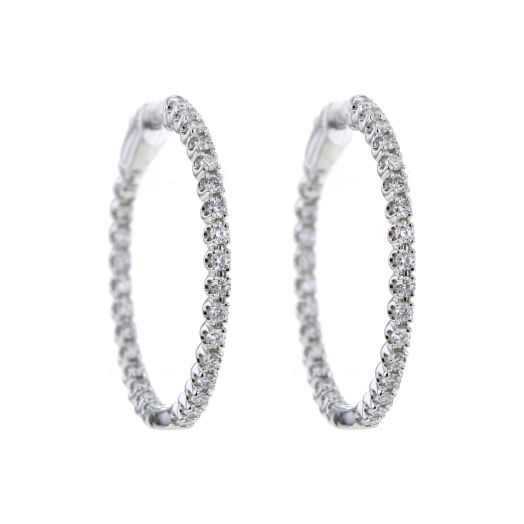 white gold hoop earrings lined with diamonds on the inside and outside of each hoop earring
