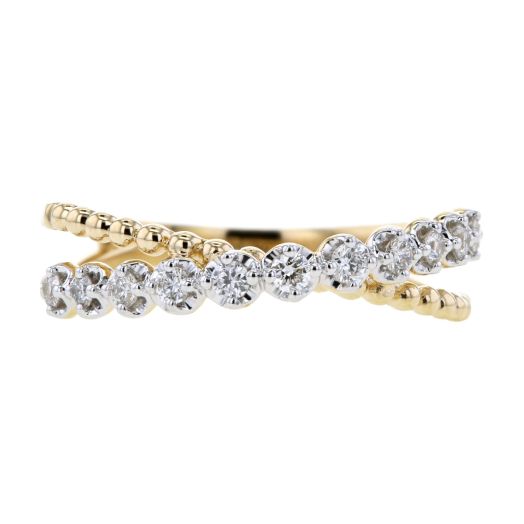 yellow gold crossover ring with beaded design and white diamond rounds