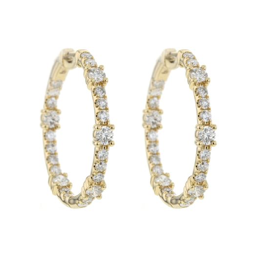 yellow gold hoop earrings lined with diamonds on the outer and inner of each earring. Diamond stations also line the earrings with a 3d effect