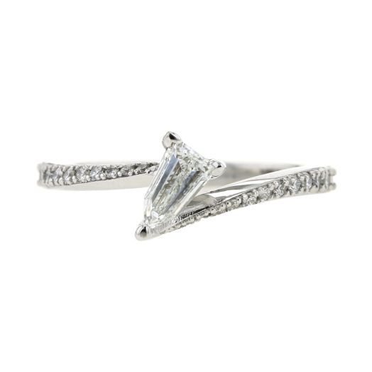white gold bypass ring with bullet-shaped diamond center stone and diamond lined band