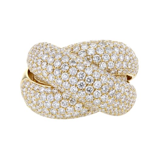 yellow gold crossover ring covered with pave diamonds