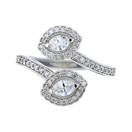 Wrap ring crafted in platinum featuring marquise and round cut diamonds