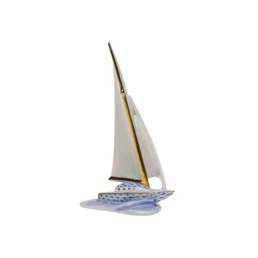 blue sailboat with fishnet design and white sail with golden accents