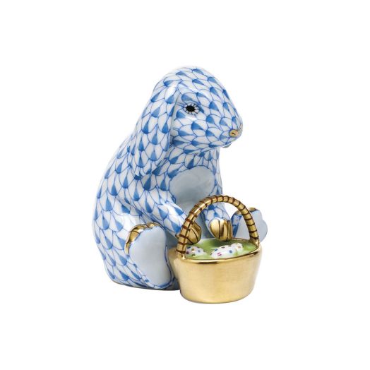 blue bunny sitting with basket filled with eggs