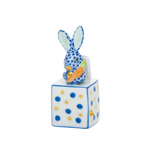 Porcelain Herend Jack in the Box Bunny figurine in sapphire blue, featuring a bunny with fishnet design emerging from a box.