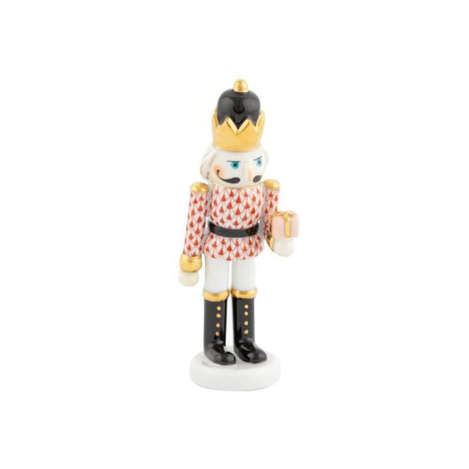 Herend porcelain figurine: rust‑colored nutcracker holding a wrapped gift