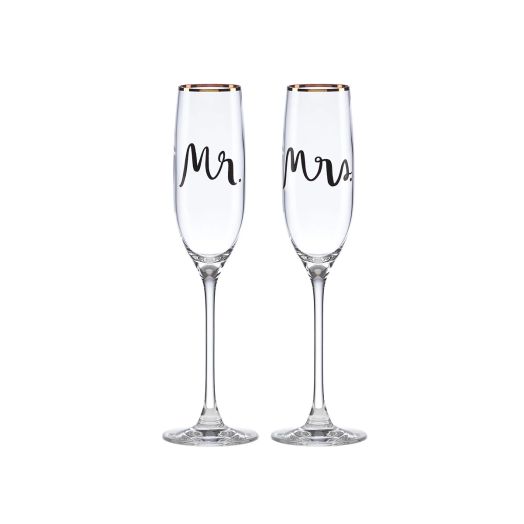 glass flutes with golden accents, one says Mr. and one says Mrs.