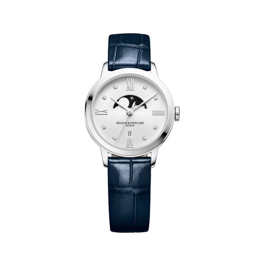 watch with blue textured strap and light colored dial with moon phase and diamond accents