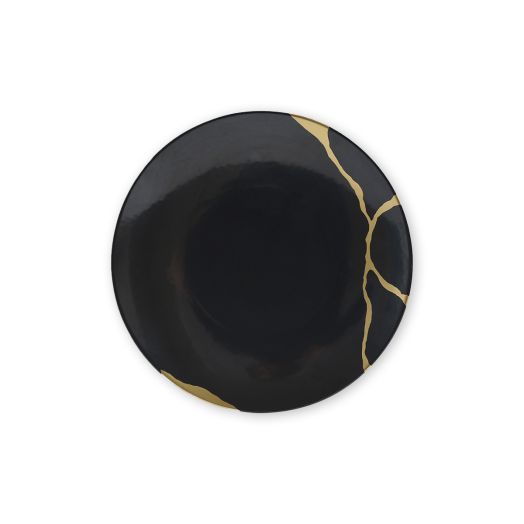 Charcoal‑black porcelain plate featuring fine gold Kintsugi-style fissure design
