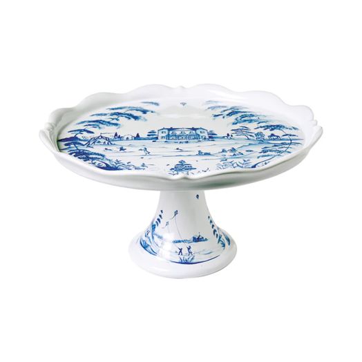 white cake stand with blue accents in a country scene