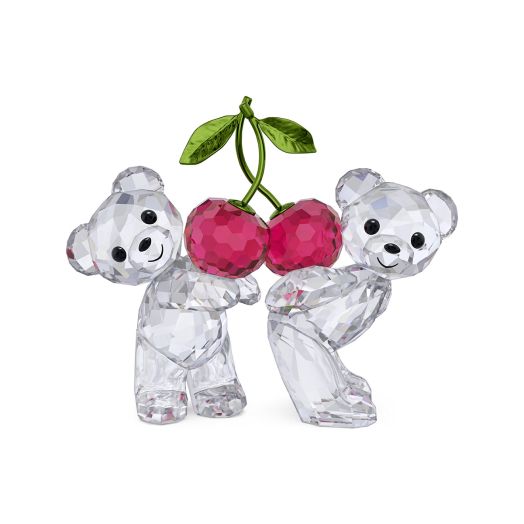 Two crystal bear figurines holding up cherries together