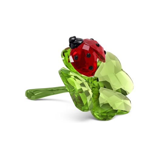 clover figurine with lady bug perched on top