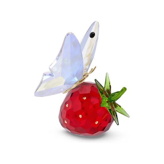 strawberry figure with butterfly on top