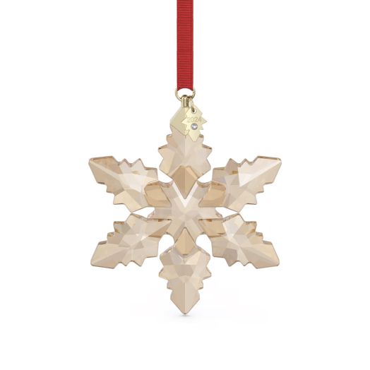 champagne colored snowflake ornament with red ribbon