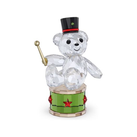 Crystal bear figurine sitting on a dum