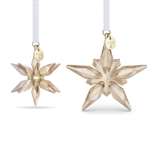 cystal snowflake ornaments in champagne gold tone suspended from white ribbon