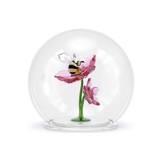 pink flower and bee figurine inside glass dome