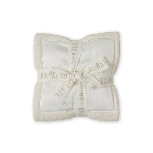 cream colored blanket in ribbon