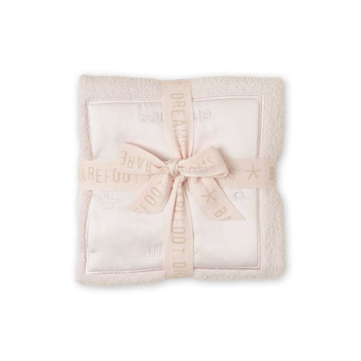 fuzzy pink blanket wrapped in ribbon