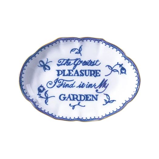 porcelain tray with scalloped edge and the inscription "The greatest pleasure I find is in my garden," featuring a blue floral border
