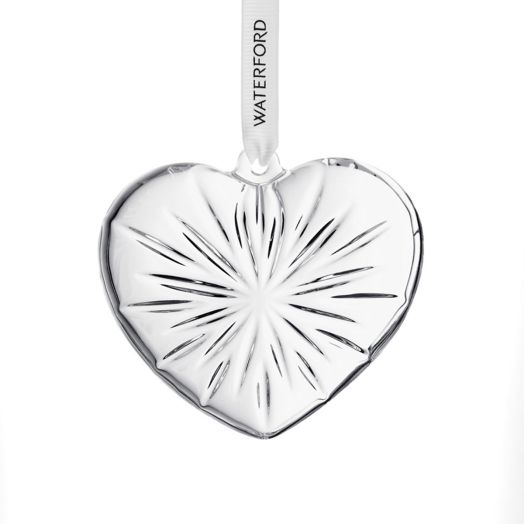 crystal heart shaped ornament suspended from white ribbon