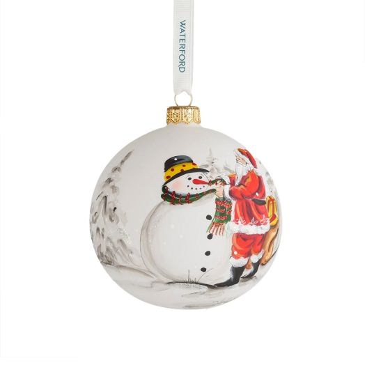 white ornament with illustration of santa and snowman suspended from white ribbon