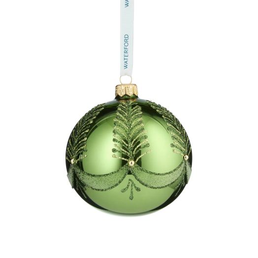 green ornament suspended from white ribbon
