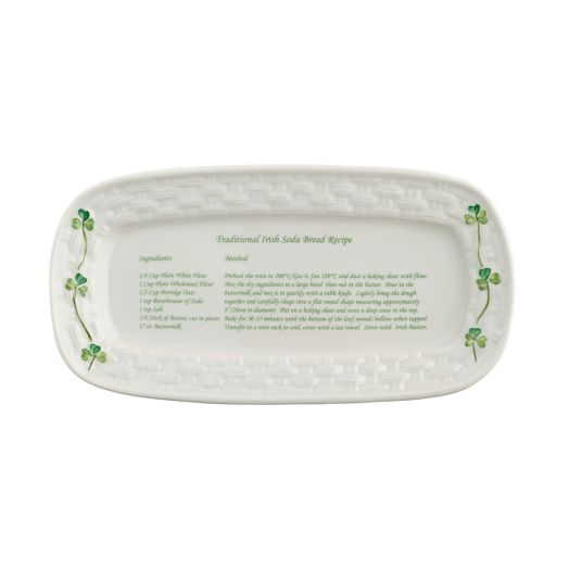white tray with shamrock accents and recipe for soda bread in the center